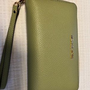 Michael Kors Jet Set Travel Pebbled Leather wristlet Wallet in color light sage